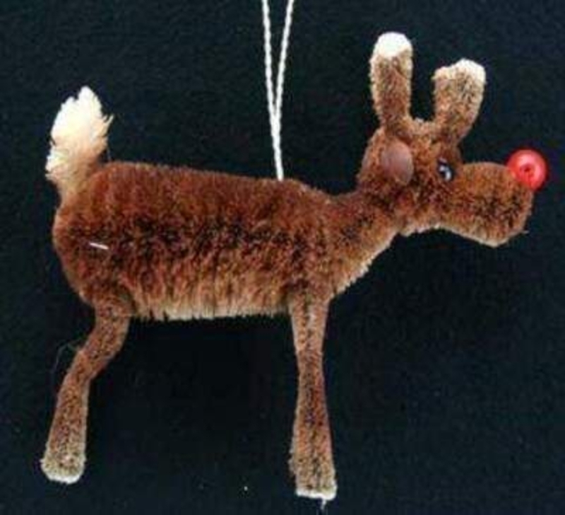 Bristle Red Nose Rudolf Reindeer Christmas Tree Decoration by Gisela Graham. This is a Hanging Christmas Tree Decoration. Made from Bristle with as large shiny red nose for Rudolph Gisela Graham has really created a charming addition to any Christmas Tree. Size 13x11x3.5cm<br><br>
If it is Christmas Tree Decorations to be sent anywhere in the UK you are after than look no further than Booker Flowers and Gifts Liverpool UK. Our Tree Decorations are specially selected from across a range of suppliers. This way we can bring you the very best of what is available in Tree Decorations.<br><br>
Reindeers are a really festive motive and Gisela Graham has lots of beautiful reindeer in her collection. Christmas Tree Decorations, candle holders, and ornaments. If it is reindeer you love look no further than Gisela Graham Reindeer for beautiful Christmas Decoration.<br><br>
Gisela loves Christmas Gisela Graham Limited is one of Europes leading giftware design companies. Gisela made her name designing exquisite Christmas and Easter decorations. However she has now turned her creative design skills to designing pretty things for your kitchen - home and garden. She has a massive range of over 4500 products of which Gisela is personally involved in the design and selection of. In their own words Gisela Graham Limited are about marking special occasions and celebrations. Such as Christmas - Easter - Halloween - birthday - Mothers Day - Fathers Day - Valentines Day - Weddings Christenings - Parties - New Babies. All those occasions which make life special are beautifully celebrated by Gisela Graham Limited.<br><br>
Christmas and it is her love of this occasion which made her company Gisela Graham Limited come to fruition. Every year she introduces completely new Christmas Collections with Unique Christmas decorations. Gisela Grahams Christmas ranges appeal to all ages and pockets.<br><br>
Gisela Graham Christmas Decorations are second not none a really large collection of very beautiful items she is especially famous for her Fairies and Nativity. If it is really beautiful and charming Christmas Decorations you are looking for think no further than Gisela Graham.<br><br>
This beautiful bristle reindeer Christmas tree decoration by Gisela Graham is really fun and will compliment any Christmas Decoration traditional or modern. Brought out year after year this Christmas Reindeer will be a favorite Christmas decoration. Remember Booker Flowers and Gifts for Reindeer Christmas Tree Decorations by Gisela Graham.
